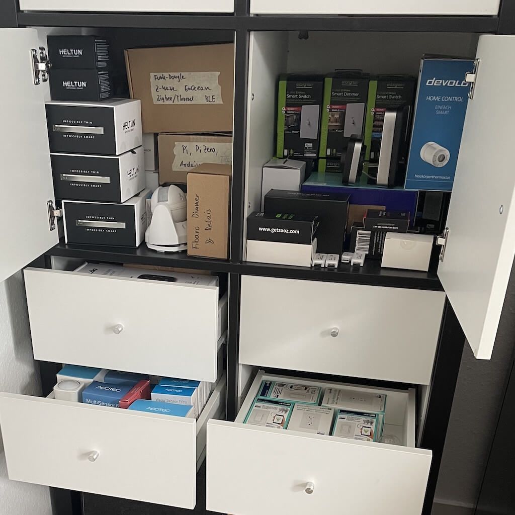 A photo of a closet full of boxes with Z-Wave devices